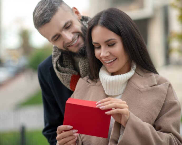 Happy young woman receiving a love letter