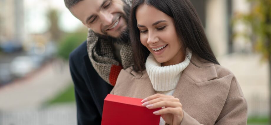 Happy young woman receiving a love letter